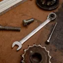 Adjustable wrench with ratchet and retaining ring. - 12